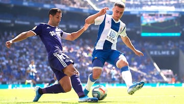 BARCELONA, SPAIN - SEPTEMBER 29: Adria Pedrosa of RCD Espanyol fights for the ball with Javi Moyano of Real Valladolid CF during the Liga match between RCD Espanyol and Real Valladolid CF at RCDE Stadium on September 29, 2019 in Barcelona, Spain. (Photo b