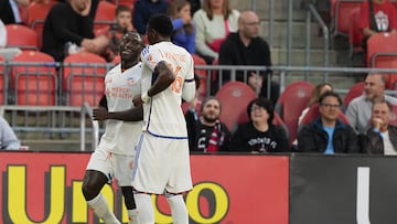 May 14, 2025; Toronto, Ontario, CAN; FC Cincinnati forward Kevin Denkey (9) scores a goal and celebrates with defender Teenage Hadebe (16) against Toronto FC during the first half at BMO Field. Mandatory Credit: Nick Turchiaro-Imagn Images