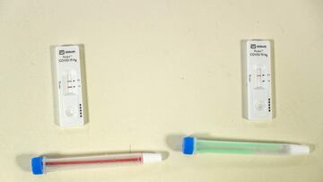 A picture taken on December 15, 2020 shows two samples of Covid-19 coronavirus&#039; test, one of them is negative (R) and the other one is positive (L) during a Covid-19 mass testing campaign in Montivillliers, northern France. - In order to deploy the n