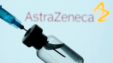 FILE PHOTO: A vial and sryinge are seen in front of a displayed AstraZeneca logo in this illustration taken January 11, 2021. REUTERS/Dado Ruvic/Illustration/File Photo