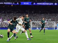 Manchester City's Portuguese defender #03 Ruben Dias (L) and Real Madrid's Uruguayan midfielder #08 Federico Valverde fight for the ball during the UEFA Champions League last 16 first leg football match between Real Madrid CF and Manchester City at Santiago Bernabeu Stadium in Madrid on March 11, 2026. (Photo by Pierre-Philippe MARCOU / AFP)