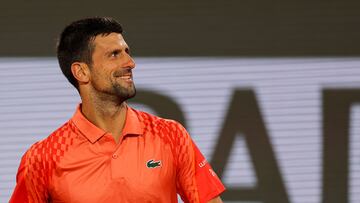 Serbia's Novak Djokovic celebrates after winning against Hungary's Marton Fucsovics at the end of their men's singles match on day four of the Roland-Garros Open tennis tournament at the Court Philippe-Chatrier in Paris on May 31, 2023. (Photo by Thomas SAMSON / AFP)