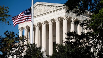 The American flag flies at half staff for late US Supreme Court Justice Ruth Bader Ginsberg outside the US Supreme Court in Washington, DC, September 21, 2020. - Ruth Bader Ginsburg will lie in repose at the Supreme Court on September 23 and September 24,