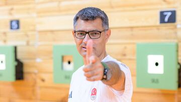 Olympic silver medalist shooter Yusuf Dikec who shoots in the mixed team 10-metre air pistol category in the 2024 Paris Olympic Games and won the silver medal poses for a photograph, in Ankara on August 9, 2024. (Photo by Yasin AKGUL / AFP)