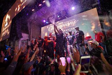 TORONTO, ON - JUNE 13: Toronto rapper Drake sprays the crowd with champaign as Toronto Raptors beat the Golden State Warriors in Game Six of the NBA Finals, during a viewing party in Jurassic Park outside of Scotiabank Arena on June 13, 2019 in Toronto, C