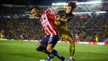 Roberto Alvarado (L) of Guadalajara fights o the ball with Igor Lichnovsky (R) of America during the 8th round match between America and Guadalajara as part of the Liga BBVA MX, Torneo Apertura 2025 at Ciudad de los Deportes Stadium, on September 13, 2025 in Mexico City, Mexico.