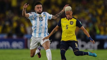 (FILES) In this file photo taken on March 29, 2022 Argentina's Nicolas Gonzalez (L) and Ecuador's Byron Castillo vie for the ball during their South American qualification football match for the FIFA World Cup Qatar 2022 at the Isidro Romero Monumental Stadium in Guayaquil, Ecuador. - The Ecuadoran football federation said on November 15, 2022 that defender Byron Castillo had been left out of the nation's World Cup squad to avoid further "unfair sanctions" in a dispute over the player's nationality. Last week the Court of Arbitration for Sport ruled that Castillo was eligible to play in Qatar but sanctioned the federation over the "falsification" of his passport. (Photo by Jos� J�come / POOL / AFP)