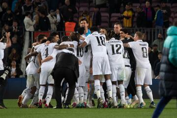 Real Madrid celebrate after beating FC Barcelona 0-4 at Camp Nou to get to the Copa del Rey final.