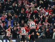 Soccer Football - Premier League - Sunderland v Newcastle United - Stadium of Light, Sunderland, Britain - December 14, 2025 Sunderland players celebrate their first goal, an own goal scored by Newcastle United's Nick Woltemade REUTERS/Scott Heppell EDITORIAL USE ONLY. NO USE WITH UNAUTHORIZED AUDIO, VIDEO, DATA, FIXTURE LISTS, CLUB/LEAGUE LOGOS OR 'LIVE' SERVICES. ONLINE IN-MATCH USE LIMITED TO 120 IMAGES, NO VIDEO EMULATION. NO USE IN BETTING, GAMES OR SINGLE CLUB/LEAGUE/PLAYER PUBLICATIONS. PLEASE CONTACT YOUR ACCOUNT REPRESENTATIVE FOR FURTHER DETAILS..
