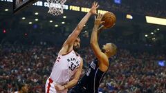 Apr 13, 2019; Toronto, Ontario, CAN; Toronto Raptors center Marc Gasol (33) defends against Orlando Magic guard Evan Fournier (10) during the first half of game one of the first round of the 2019 NBA Playoffs at Scotiabank Arena. Mandatory Credit: John E. Sokolowski-USA TODAY Sports