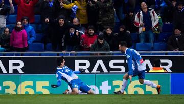 BARCELONA, SPAIN - FEBRUARY 27: Gerard Moreno of RCD Espanyol celebrates with his teammate Sergio Garcia after scoring the opening goal during the La Liga match between Espanyol and Real Madrid at RCDE Stadium on February 27, 2018 in Barcelona, Spain. (Ph