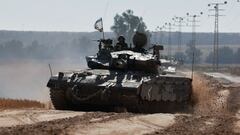 Israeli soldiers gesture in a tank, amid the ongoing conflict between Israel and the Palestinian Islamist group Hamas, near the Israel-Gaza Border, in Israel, May 6, 2024. REUTERS/Ammar Awad     TPX IMAGES OF THE DAY