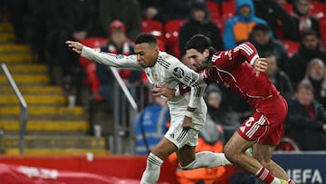 Real Madrid's French forward #10 Kylian Mbappe (L) vies with Liverpool's Hungarian midfielder #08 Dominik Szoboszlai (R) during the UEFA Champions League, league phase football match between Liverpool and Real Madrid at Anfield in Liverpool, north west England on November 4, 2025. (Photo by Paul ELLIS / AFP)