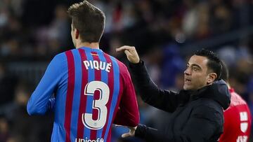 Gerard Piqué y Xavi.