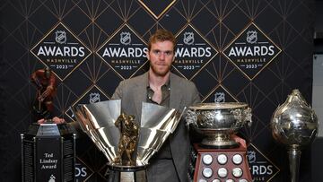 Edmonton Oilers center Connor McDavid poses with the (left to right) Ted Lindsay Award