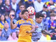 Jonathan Herrera (L) of Tigres fights fo rthe ball with Kevin Alvarez (R) of America during the friendly match between America and Tigres UANL as part the Golden Clash Mens at Donald W. Reynolds Razorback Stadium, on March 28, 2026 in Fayetteville, Arkansas, United States.