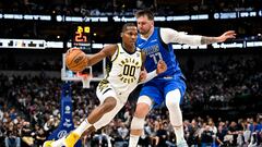 Mar 5, 2024; Dallas, Texas, USA; Indiana Pacers guard Bennedict Mathurin (00) brings the ball up court past Dallas Mavericks guard Luka Doncic (77) during the second half at the American Airlines Center. Mandatory Credit: Jerome Miron-USA TODAY Sports