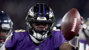 BALTIMORE, MARYLAND - JANUARY 20: Lamar Jackson #8 of the Baltimore Ravens scores an 8 yard touchdown against the Houston Texans during the fourth quarter in the AFC Divisional Playoff game at M&T Bank Stadium on January 20, 2024 in Baltimore, Maryland. Rob Carr/Getty Images/AFP (Photo by Rob Carr / GETTY IMAGES NORTH AMERICA / Getty Images via AFP)