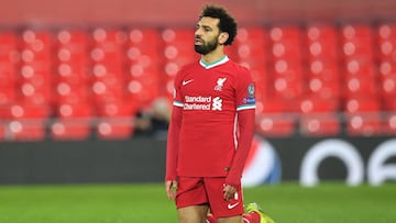 Liverpool's Egyptian midfielder Mohamed Salah reacts during the UEFA Champions League quarter final second leg football match between Liverpool and Real Madrid at Anfield in Liverpool, north west England on April 14, 2021. (Photo by Paul ELLIS / AFP)
