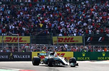 Lewis Hamilton of Great Britain and Mercedes GP celebrates after winning his fourth F1 World Drivers Championship during the Formula One Grand Prix of Mexico at Autodromo Hermanos Rodriguez on October 29