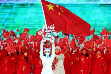 BEIJING, CHINA - FEBRUARY 04: Flag bearers Tingyu Gao and Dan Zhao of Team China carry their flag during the Opening Ceremony of the Beijing 2022 Winter Olympics at the Beijing National Stadium on February 04, 2022 in Beijing, China. (Photo by Lintao Zhan