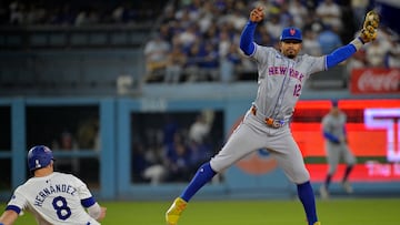 Oct 13, 2024; Los Angeles, California, USA; Los Angeles Dodgers third base Enrique Hernández (8) slides safely into second bae against New York Mets shortstop Francisco Lindor (12) in the eighth inning during game one of the NLCS for the 2024 MLB Playoffs at Dodger Stadium. Mandatory Credit: Jayne Kamin-Oncea-Imagn Images