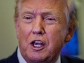 FILE PHOTO: U.S. President Donald Trump speaks with members of the media on board Air Force One en route to Palm Beach, Florida, U.S., February 6, 2026. REUTERS/Ken Cedeno/File Photo