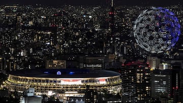 Drones fly to form an image of the Earth in the sky over the Olympic Stadium during the opening ceremony of the Tokyo 2020 Olympic Games, in Tokyo, on July 23, 2021. (Photo by Charly TRIBALLEAU / AFP)