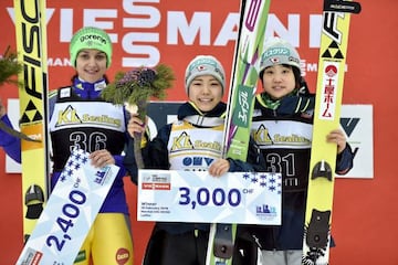 Sara Takanashi of Japan takes 1st place, Maja Vtic of Slovenia takes 2nd place, Yuki Ito of Japan takes 3rd place during the FIS Nordic World Cup Women's Ski Jumping