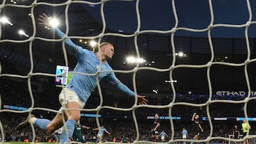 Manchester City's Norwegian striker Erling Haaland celebrates after scoring the opening goal in the English FA Cup quarter-final football match between Manchester City and Burnley at the Etihad Stadium in Manchester, north-west England, on March 18, 2023. (Photo by Oli SCARFF / AFP) / RESTRICTED TO EDITORIAL USE. No use with unauthorized audio, video, data, fixture lists, club/league logos or 'live' services. Online in-match use limited to 120 images. An additional 40 images may be used in extra time. No video emulation. Social media in-match use limited to 120 images. An additional 40 images may be used in extra time. No use in betting publications, games or single club/league/player publications. / 