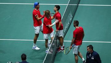 MADRID, SPAIN - NOVEMBER 22: Andrey Rublev of Russia and team mate Karen Khachanov shakes hands with Novak Djokovic of Serbia and team mate Viktor Troicki after winning the quarter final doubles match on Day Five of the 2019 Davis Cup at La Caja Magica on November 22, 2019 in Madrid, Spain. (Photo by Clive Brunskill/Getty Images)