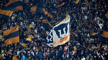 Pumas' fans cheer for their team during the Liga MX Clausura football match between Pumas and America at the Olimpico Universitario stadium in Mexico City on February 22, 2025. (Photo by Alfredo ESTRELLA / AFP)
