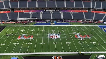 Workers prepare the field one day before Super Bowl LVI between the Los Angeles Rams and the Cincinatti Bengals at So-Fi Stadium in Inglewood, California on February 12, 2022. (Photo by VALERIE MACON / AFP)