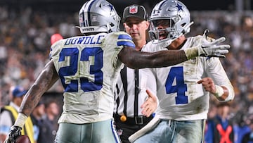 Oct 6, 2024; Pittsburgh, Pennsylvania, USA; Dallas Cowboys running back Rico Dowdle (23) celebrates a touchdown with quarterback Dak Prescott against the Pittsburgh Steelers during the fourth quarter at Acrisure Stadium. Mandatory Credit: Barry Reeger-Imagn Images
