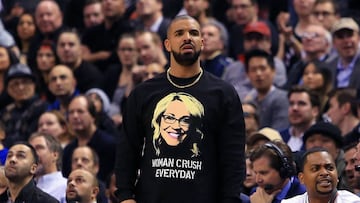 Drake looks on from his courtside seat during the second half of an NBA game between the Golden State Warriors and the Toronto Raptors at Air Canada Centre on November 16, 2016 in Toronto, Canada.