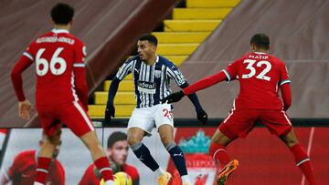 Liverpool's English defender Trent Alexander-Arnold (L) and Liverpool's German-born Cameroonian defender Joel Matip (R) close in on West Bromwich Albion's English striker Karlan Grant during the English Premier League football match between