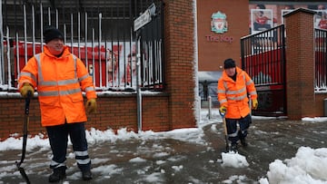 Liverpool and Manchester United are scheduled to play at Anfield today, but heavy snowfall has put the game in doubt.