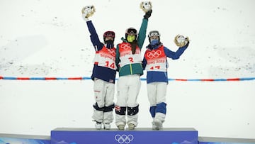 ZHANGJIAKOU, CHINA - FEBRUARY 06: Gold medallist Jakara Anthony of Team Australia (C), Silver medallist Jaelin Kauf of Team United States (L) and Bronze medallist Anastasia Smirnova of Team ROC (R) celebrate during the Women&#039;s Freestyle Skiing Moguls