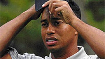 <B>PREOCUPADO.</B> Tiger Woods no sabe qué hacer con el Masters.