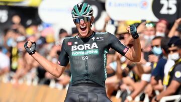 08 July 2021, France, Nimes: German cyclist Nils Politt of Bora-Hansgrohe team celebrates as he crosses the finish line to win the twelfth stage of the 108th edition of the Tour de France cycling race, 159.40 KM&nbsp;from Saint-Paul-Trois-Chateaux to Nime