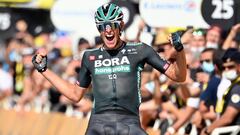 08 July 2021, France, Nimes: German cyclist Nils Politt of Bora-Hansgrohe team celebrates as he crosses the finish line to win the twelfth stage of the 108th edition of the Tour de France cycling race, 159.40 KM&nbsp;from Saint-Paul-Trois-Chateaux to Nime