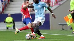 Atletico Madrid's Spanish midfielder #06 Koke and Celta Vigo's Ivorian midfielder #17 Jonathan Bamba vie for the ball during the Spanish league football match between Club Atletico de Madrid and RC Celta de Vigo at the Metropolitano stadium in Madrid on May 12, 2024. (Photo by Pierre-Philippe MARCOU / AFP)