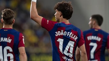 Barcelona's Portuguese forward #14 Joao Felix celebrates with teammates after scoring during the Spanish league football match between Cadiz CF and FC Barcelona at the Nuevo Mirandilla stadium in Cadiz on April 13, 2024. (Photo by JORGE GUERRERO / AFP)