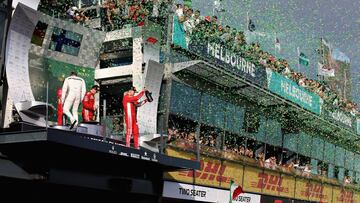 MELBOURNE, AUSTRALIA - MARCH 25: Race winner Sebastian Vettel of Germany and Ferrari, second placed Lewis Hamilton of Great Britain and Mercedes GP and third placed Kimi Raikkonen of Finland and Ferrari celebrate on the podium during the Australian Formula One Grand Prix at Albert Park on March 25, 2018 in Melbourne, Australia. (Photo by Charles Coates/Getty Images)