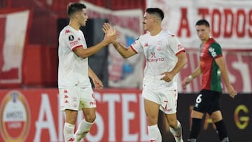 Huracan's Uruguayan forward Matias Coccaro (R) celebrates scoring his team's first goal during the second leg Copa Libertadores second stage football match between Argentina's Huracan and Uruguay's Boston River, at the Tomas Adolfo Duco stadium in Buenos Aires, on March 1st, 2023. (Photo by JUAN MABROMATA / AFP) (Photo by JUAN MABROMATA/AFP via Getty Images)