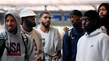 Members of the US Olympic Basketball team, Tyrese Haliburton, LeBron James, Jayson Tatum, Bam Adebayo, Jrue Holiday and Anthony Davis, react before boarding an Olympic-themed Golden Train as they prepare to travel to Paris to attend the Paris 2024 Olympic Games, from the Eurostar departures terminal at St Pancras International train station in London on July 24, 2024. (Photo by BENJAMIN CREMEL / AFP)