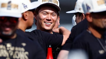 LOS ANGELES, CALIFORNIA - NOVEMBER 01: Yoshinobu Yamamoto #18 of the Los Angeles Dodgers celebrates during the 2024 World Series Celebration Show at Dodger Stadium on November 01, 2024 in Los Angeles, California. Ronald Martinez/Getty Images/AFP (Photo by RONALD MARTINEZ / GETTY IMAGES NORTH AMERICA / Getty Images via AFP)