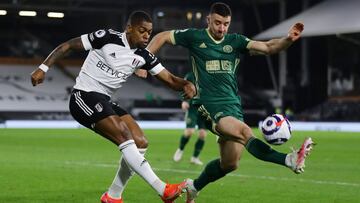 Soccer Football - Premier League - Fulham v Sheffield United - Craven Cottage, London, Britain - February 20, 2021 Fulham's Ivan Cavaleiro in action with Sheffield United's Enda Stevens Pool via REUTERS/Richard Heathcote EDITORIAL USE ONLY. No u