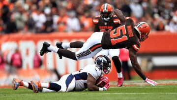 CLEVELAND, OH - OCTOBER 18: outside linebacker Barkevious Mingo #51 of the Cleveland Browns tackles running back C.J. Anderson #22 of the Denver Broncos during the first quarter at Cleveland Browns Stadium on October 18, 2015 in Cleveland, Ohio. Andrew Weber/Getty Images/AFP
== FOR NEWSPAPERS, INTERNET, TELCOS & TELEVISION USE ONLY ==