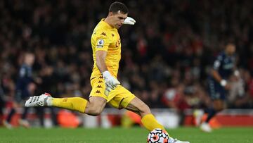 Aston Villa's Argentinian goalkeeper Emiliano Martinez kicks during the English Premier League football match between Arsenal and Aston Villa at the Emirates Stadium in London on October 22, 2021. (Photo by Glyn KIRK / AFP) / RESTRICTED TO EDITORIAL USE. No use with unauthorized audio, video, data, fixture lists, club/league logos or 'live' services. Online in-match use limited to 120 images. An additional 40 images may be used in extra time. No video emulation. Social media in-match use limited to 120 images. An additional 40 images may be used in extra time. No use in betting publications, games or single club/league/player publications. /